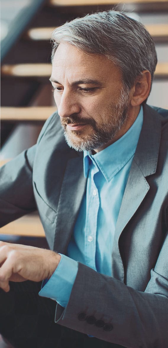 A man in suit concentrating